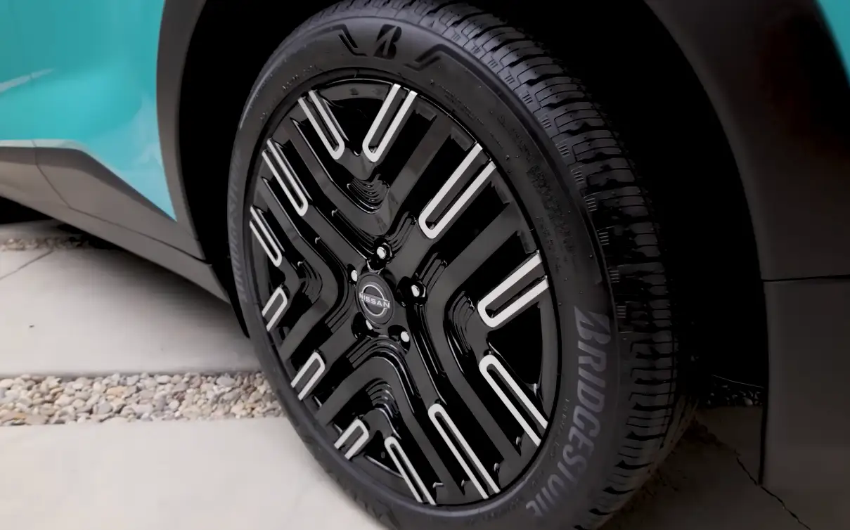 Nissan Leaf wheel affordable electric crossover value EV front-wheel drive smooth quiet commuter budget EV rivals comparison