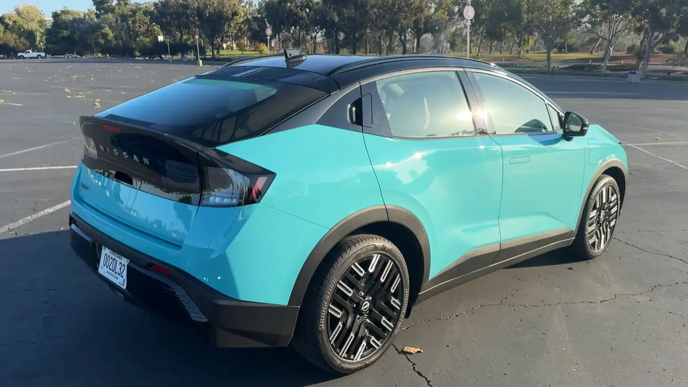 2026 Nissan Leaf crossover design Ariya cues smooth closed grille slim lights coupe roofline flush door handles affordable electric crossover