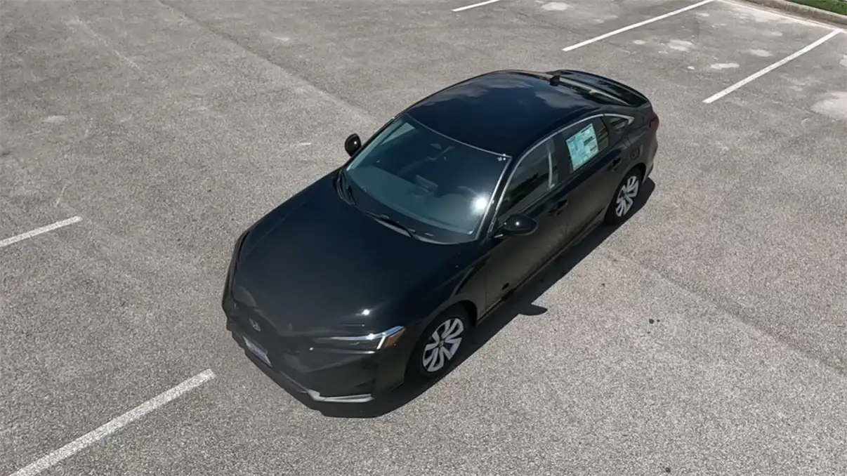 2026 Honda Civic Sedan Sport starting at 27790 showing 5-Star NHTSA safety Honda Sensing standard blind spot monitoring sport trim best first car under 35000 2026 for new drivers who want a more engaging experience