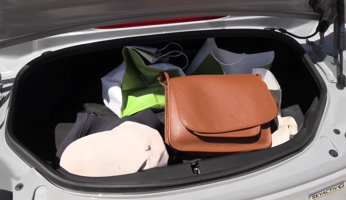Mazda MX-5 Miata 2026 cargo space showing two-seat roadster layout with limited but iconic boot space confirming Miata as best for city and open-air fun rather than cargo hauling in the affordable coupe under 40000 2026 ranking