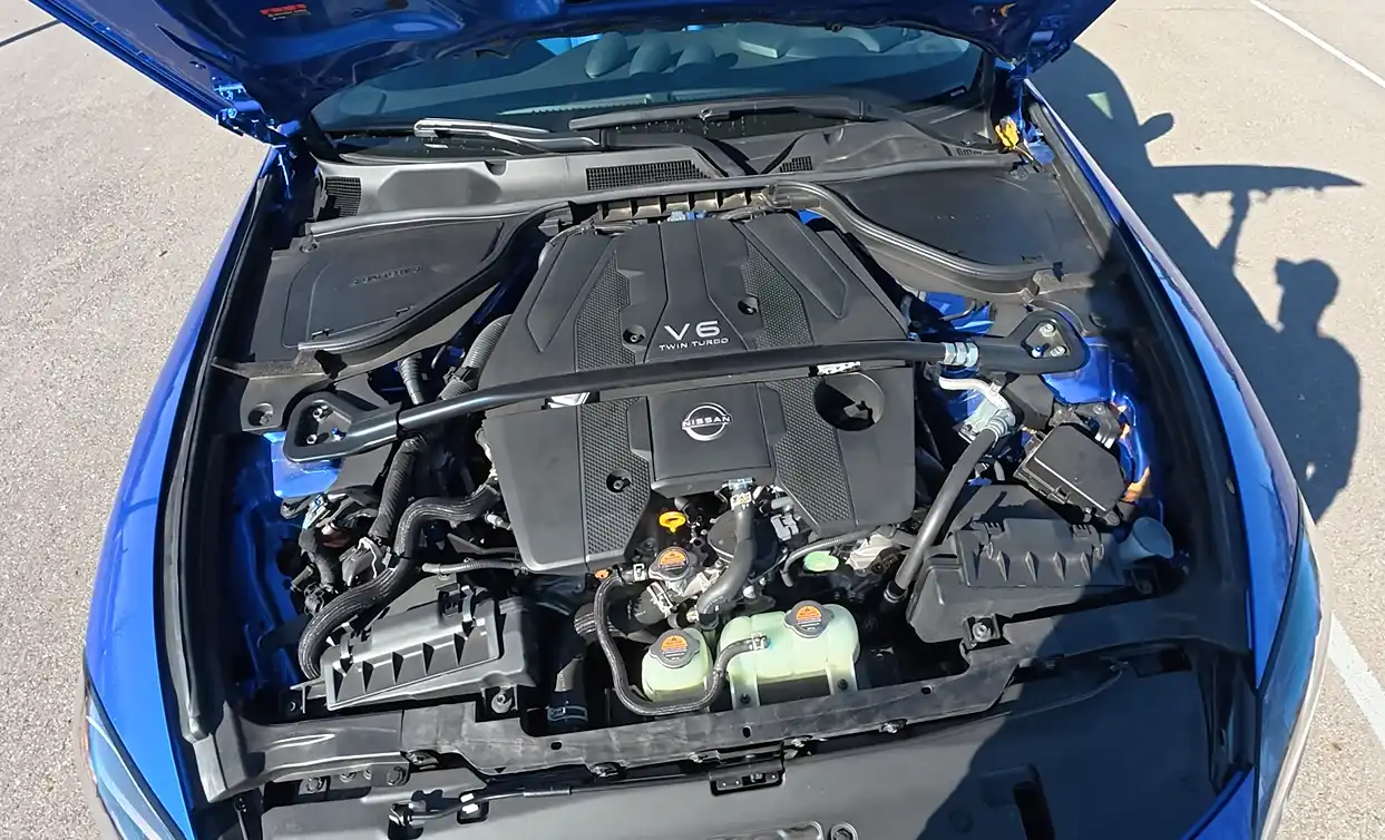 Nissan Z Sport 2026 powertrain showing 400 hp twin-turbo V6 engine delivering 18 city 24 highway MPG lowest fuel economy in group and thirstiest option but most raw horsepower for the money as honorable mention in affordable coupe under 40000 2026