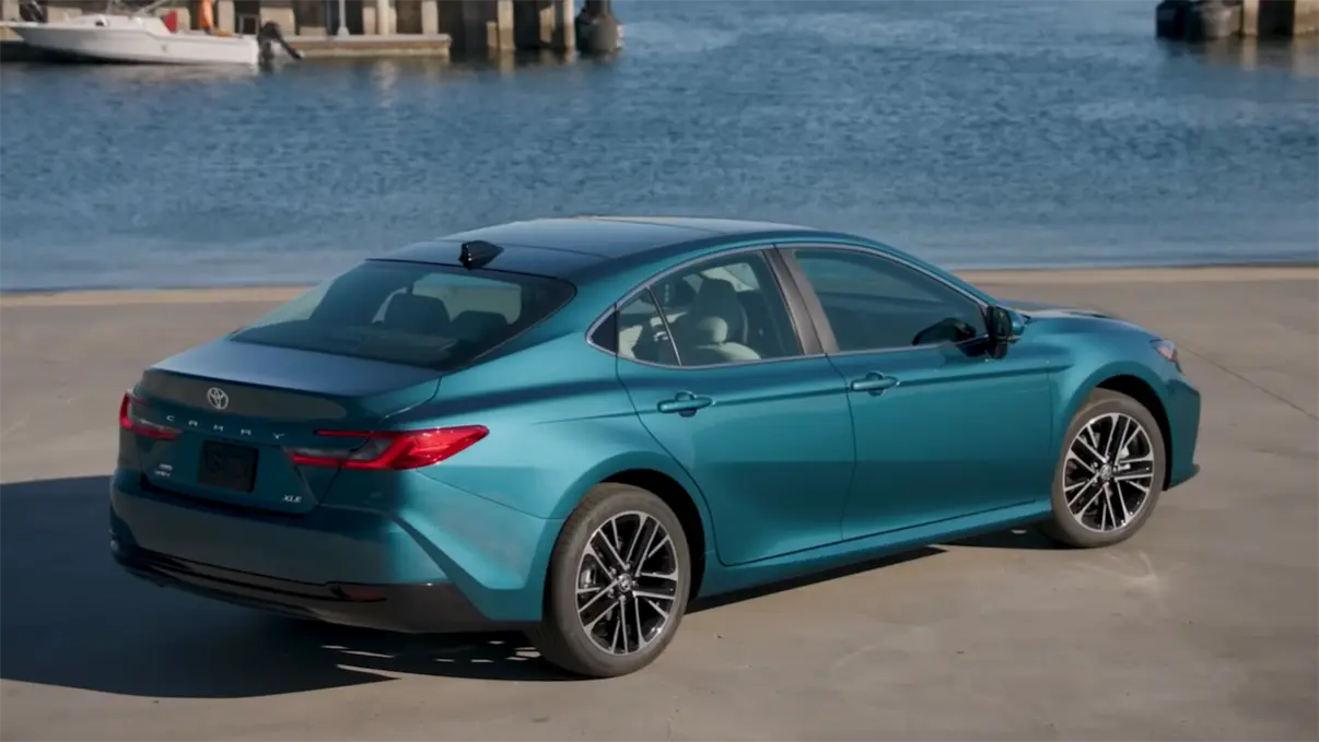 2026 Toyota Camry Hybrid review exterior showing best hybrid sedan 2026 starting at 29100 with 53 city 50 highway MPG 225 horsepower AWD available on all trims and Toyota Safety Sense standard