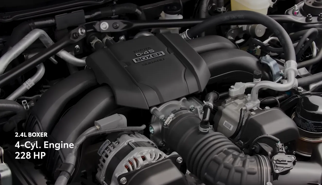 Toyota GR86 2026 powertrain showing 2.4L Boxer 4-cylinder 228 hp naturally aspirated engine paired with 6-speed manual or automatic transmission delivering 20 city 27 highway MPG and punchy acceleration through every gear