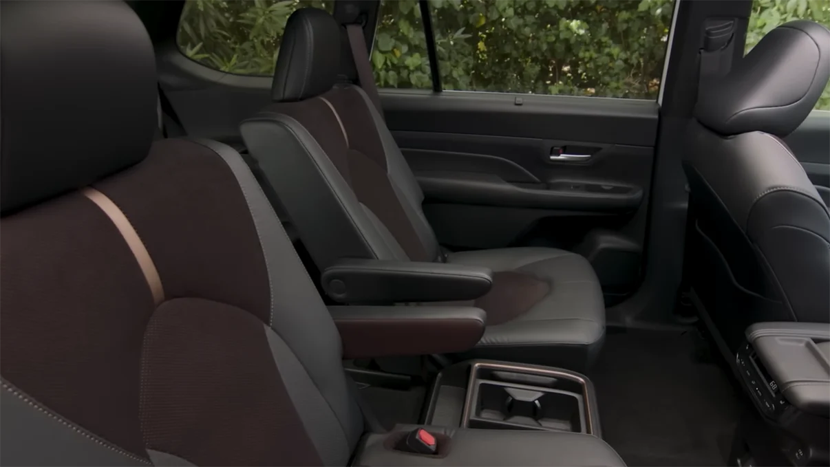 2026 Toyota Grand Highlander seating space showing 33.5 inch third row legroom adult passenger fit and 8-passenger bench seat configuration with 13 cupholders and 7 USB-C ports throughout cabin