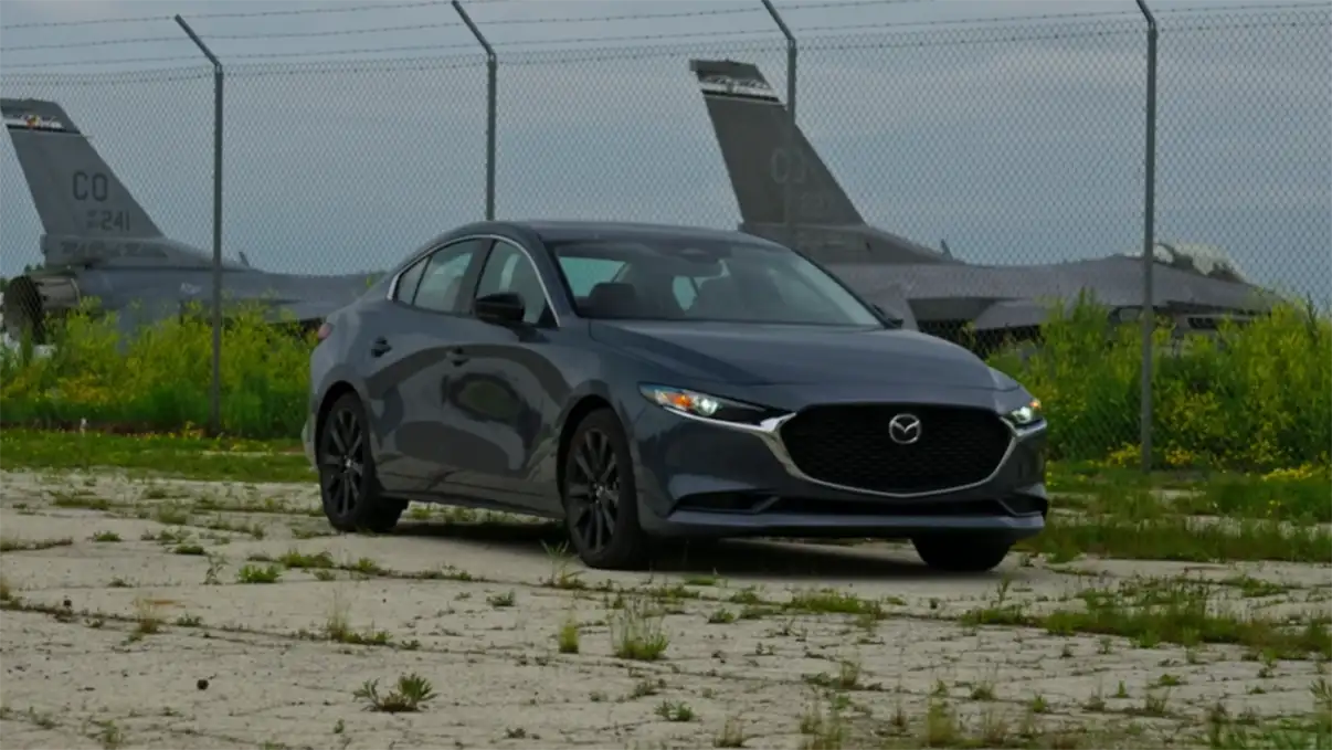 Mazda 3 2026 real world mileage US city test showing 25 to 27 MPG city stop-and-go 28 to 30 MPG combined and 35 MPG on steady 70 mph highway run for the base FWD sedan starting at 24550