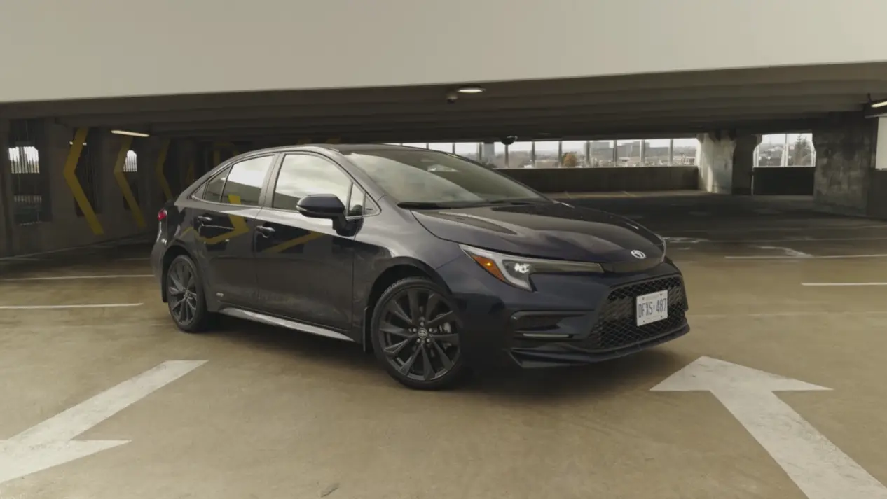 2026 Toyota Corolla Hybrid exterior review showing best budget hybrid sedan starting at 24975 with 50 MPG combined AWD available Toyota Safety Sense 3.0 standard and 200000 mile reliability for American buyers