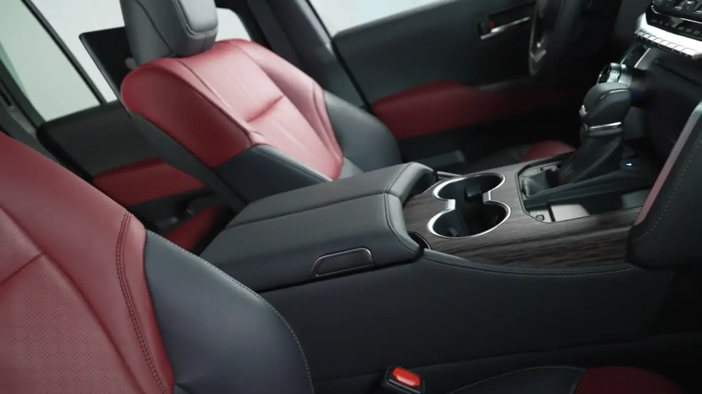 Toyota Land Cruiser 2026 interior showing 12.3-inch screen on higher trim physical climate control knobs SofTex seats on Land Cruiser trim wireless Apple CarPlay Android Auto and high-end build quality with no rattles on rough US trails