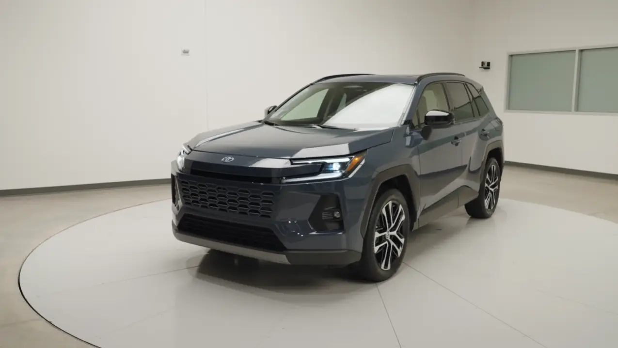 2026 Toyota RAV4 Hybrid side profile showing 236 horsepower 42 MPG EPA combined standard AWD and Toyota Safety Sense standard equipment on all trims for compact hybrid SUV buyers
