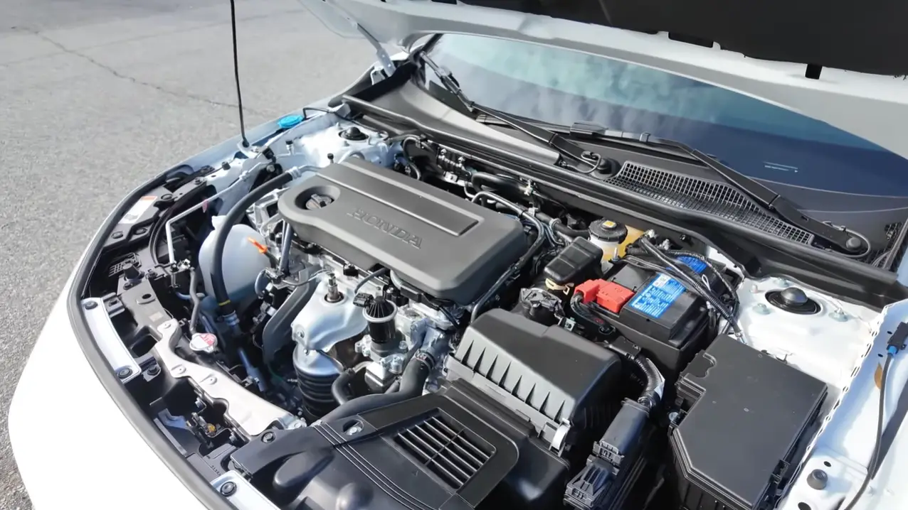 2026 Honda Civic Hatchback engine showing identical 2.0L 4-cylinder to sedan with same 150 horsepower but slightly lower 30 city 38 highway MPG due to boxy rear aerodynamics and wide liftgate design