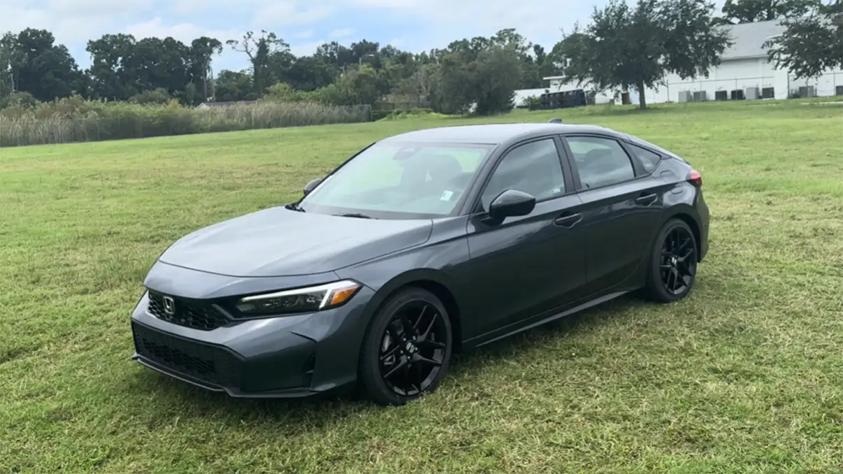 2026 Honda Civic Hatchback exterior showing wide liftgate 24.5 cubic feet cargo space shorter overall length easier city parking and 800 to 1000 dollar premium over Civic Sedan for compact car buyers needing versatility