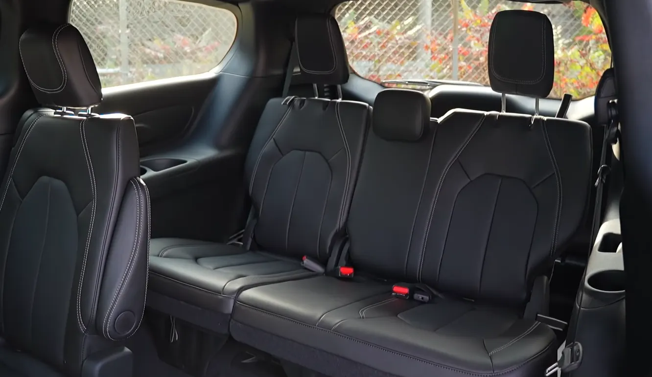 Chrysler Pacifica Hybrid 2026 third row seat showing 7-passenger layout with Stow and Go folding that eliminates lifting for cargo mode and quiet cabin ideal for kids naps video calls and homework during school run commutes