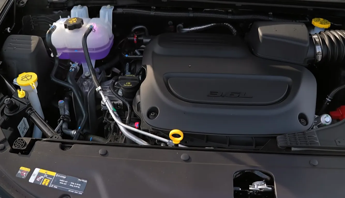 Chrysler Pacifica Hybrid 2026 engine showing plug-in hybrid powertrain delivering 82 MPGe and 30 MPG gas mode with 32-mile full electric range for school runs and grocery trips confirmed during NCR 4200 mile two-month test