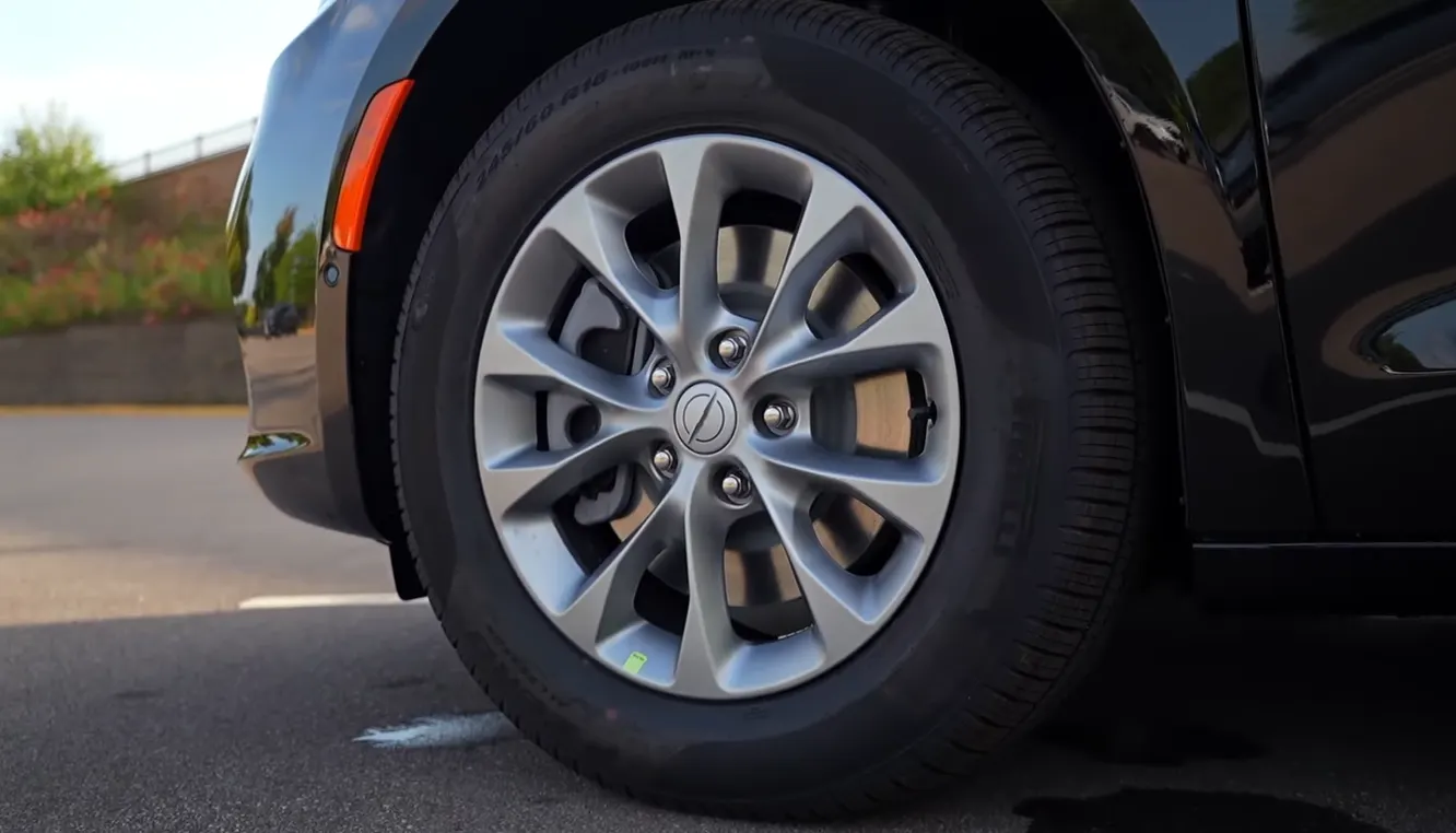 Chrysler Pacifica Hybrid 2026 wheel and exterior showing front-wheel drive hybrid family minivan proportions AWD not available on hybrid trim 5-star NHTSA and IIHS Top Safety Pick plus award in 2026 testing