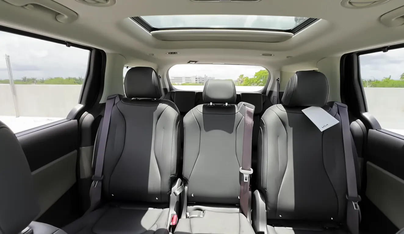Kia Carnival 2026 second row seating space showing limo-like legroom even for tall teens SX Prestige captain chairs with leg rests and genuine comfort for second row passengers making it the best people carrier MPV 2026 for big families