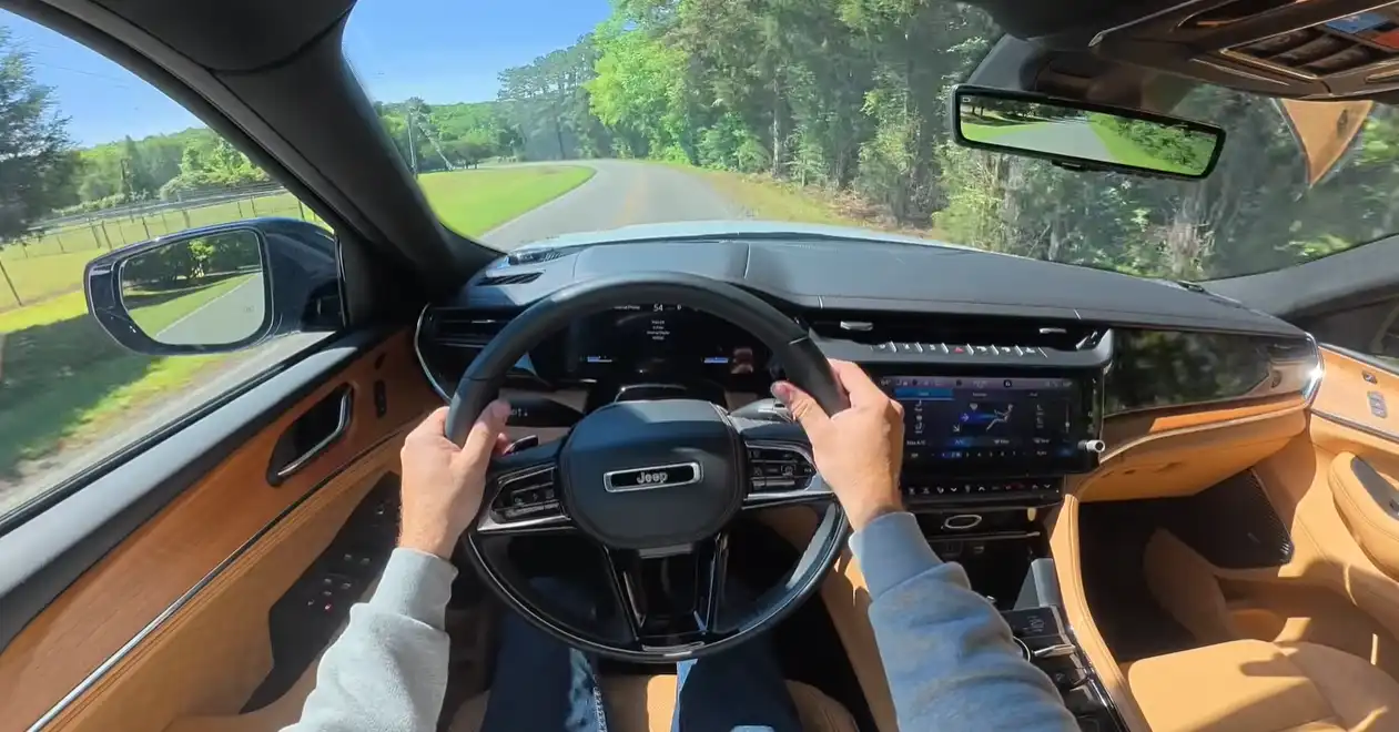 2026 Jeep Grand Cherokee interior soft leather real wood slick screens Uconnect 5 modern rich cabin comparison Toyota 4Runner