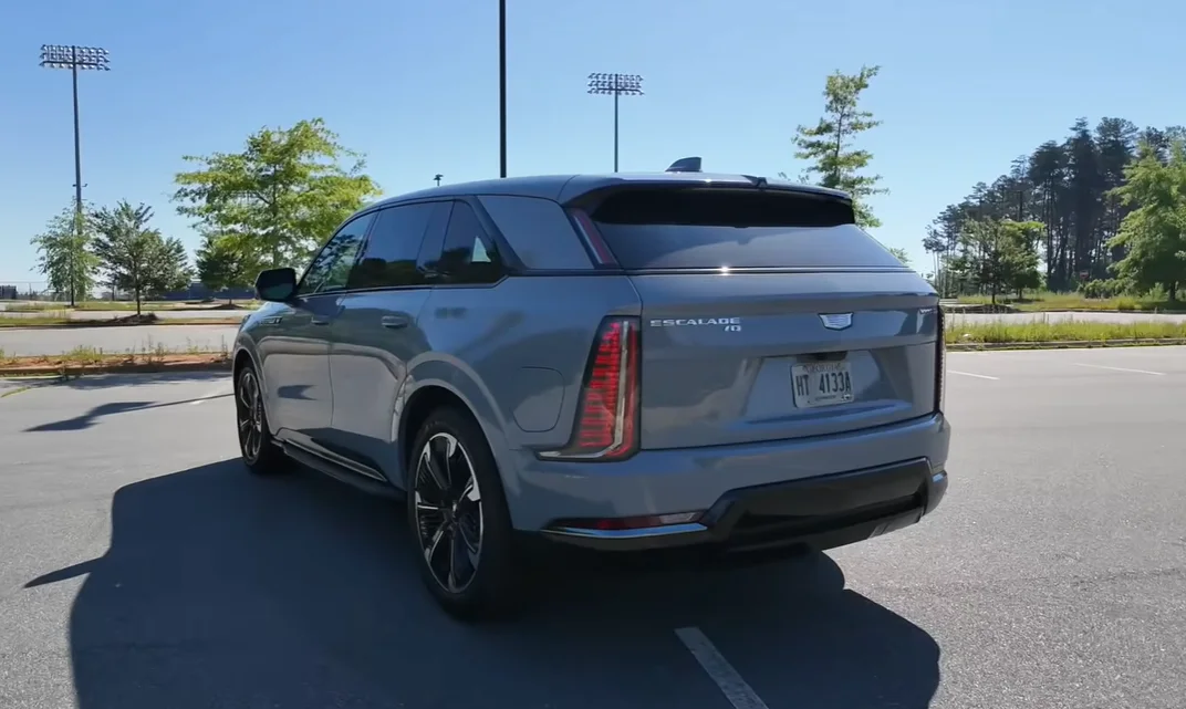 2026 Cadillac Escalade IQ back view full-width lighting vertical light signature EV sealed rear premium luxury SUV presence