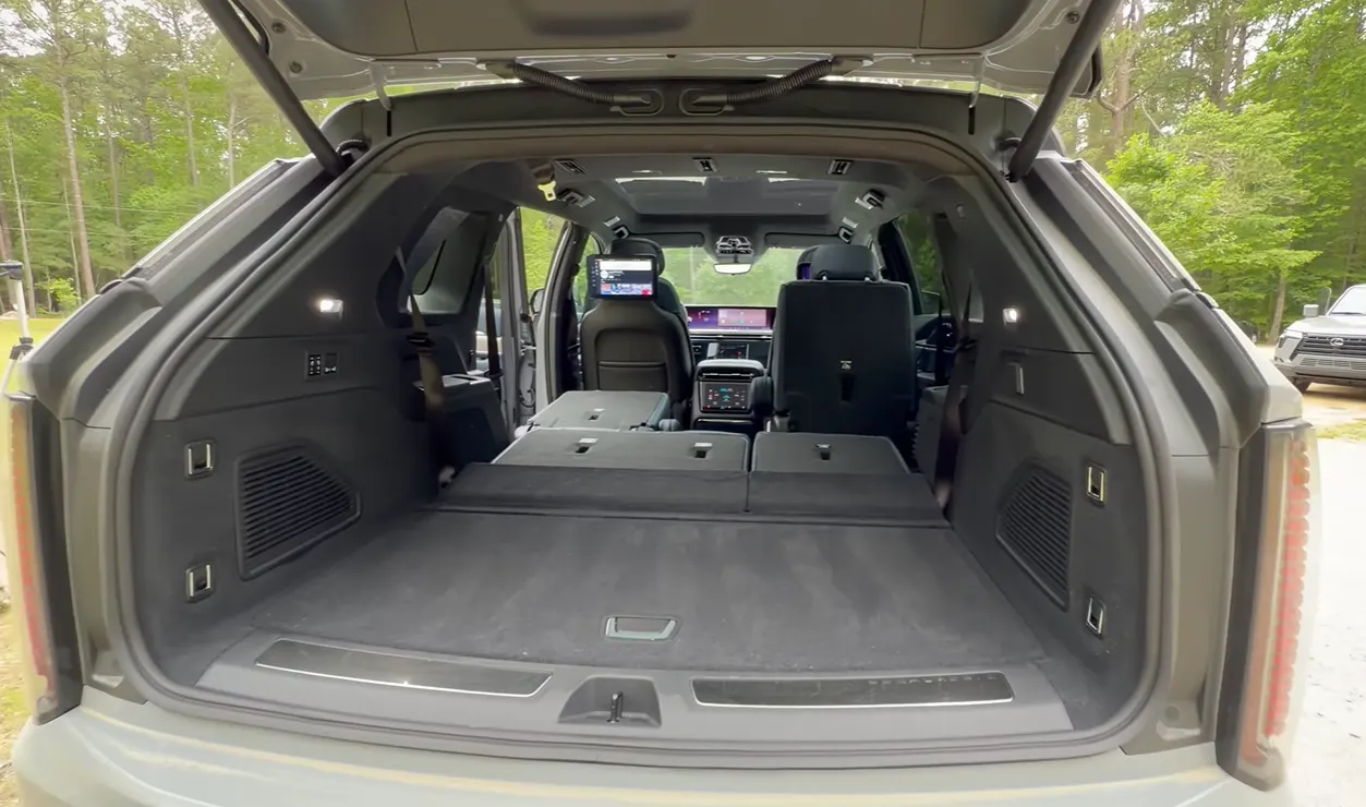 2026 Cadillac Escalade IQ cargo space behind third row large floor area power folding seats bags luggage family gear luxury EV SUV