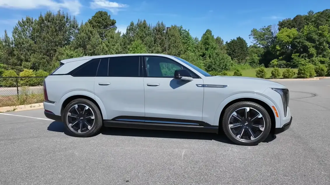 2026 Cadillac Escalade IQ side view full-size electric SUV Ultium platform wide stance signature lighting presence American luxury EV