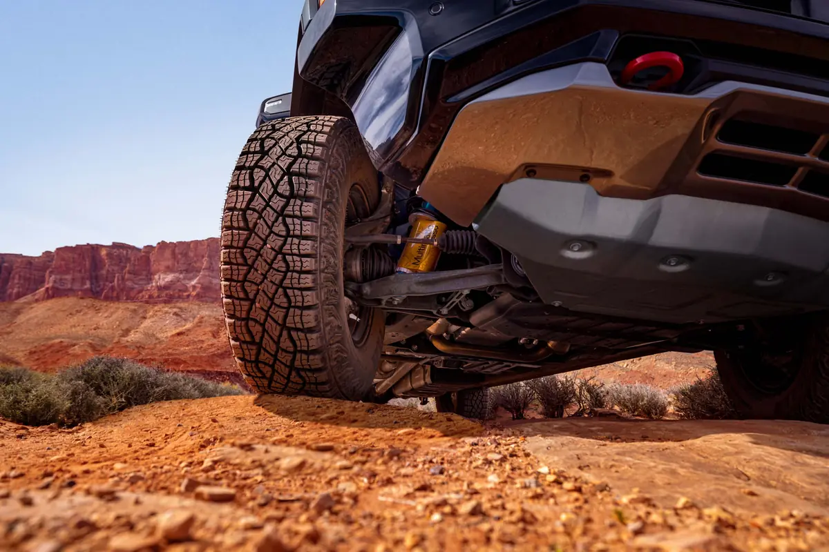 Close-up of the 2027 Chevrolet Silverado ZR2 Multimatic DSSV damper and 35 in. mud-terrain tire