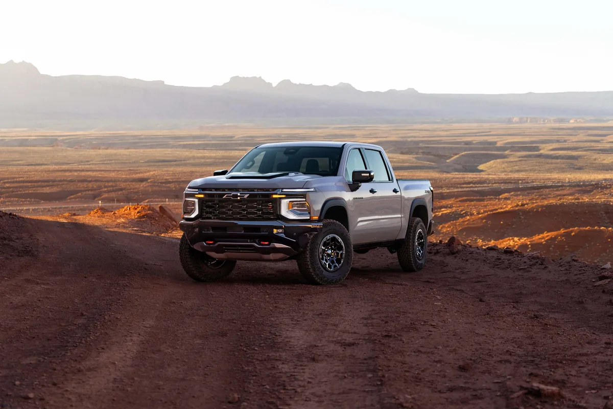 2027 Chevrolet Silverado 1500 ZR2 front three-quarter view on a desert trail
