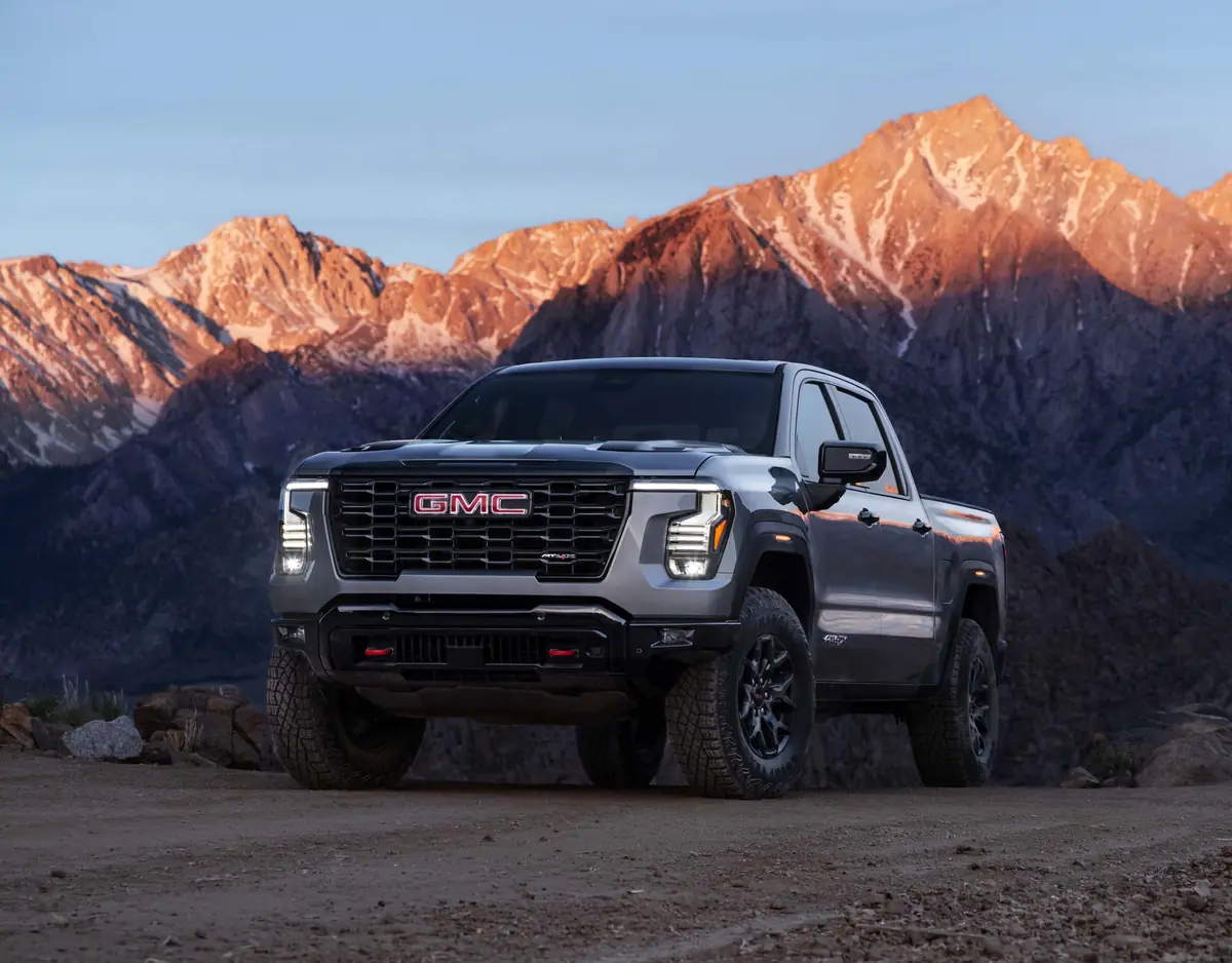 2027 GMC Sierra 1500 AT4X in Sterling Metallic, front three-quarter view in front of mountains