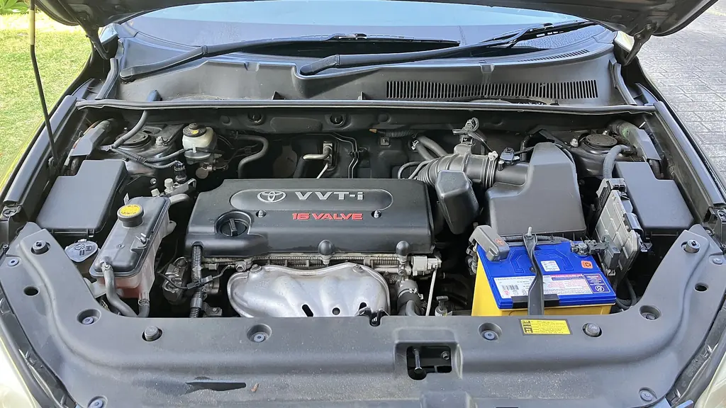 Engine bay of a 2007 Toyota RAV4 with the 2AZ-FE four-cylinder engine, the air intake duct and air cleaner box on the right