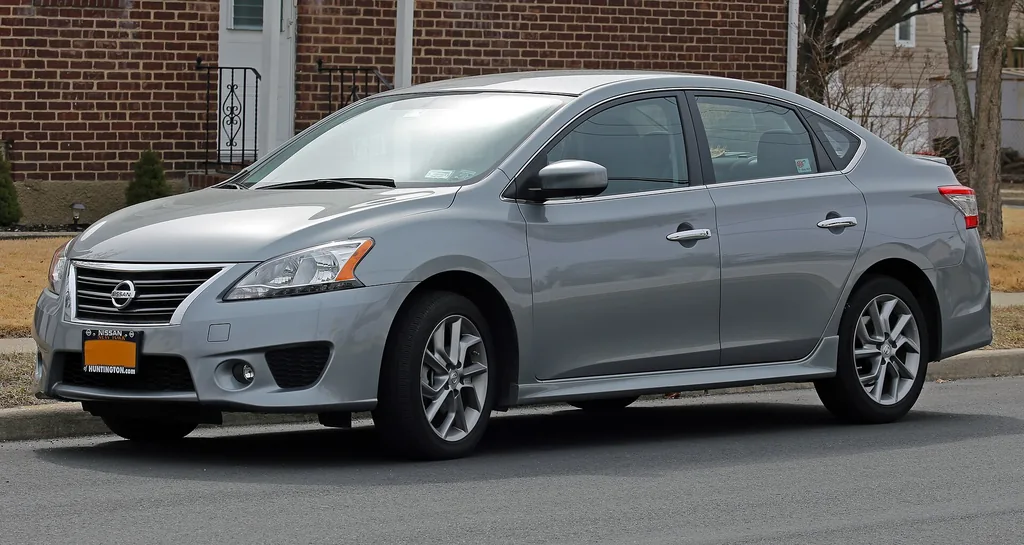 Front three-quarter view of a 2013 Nissan Sentra SR sedan