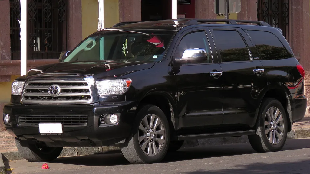 Black 2016 Toyota Sequoia Limited SUV parked at the curb