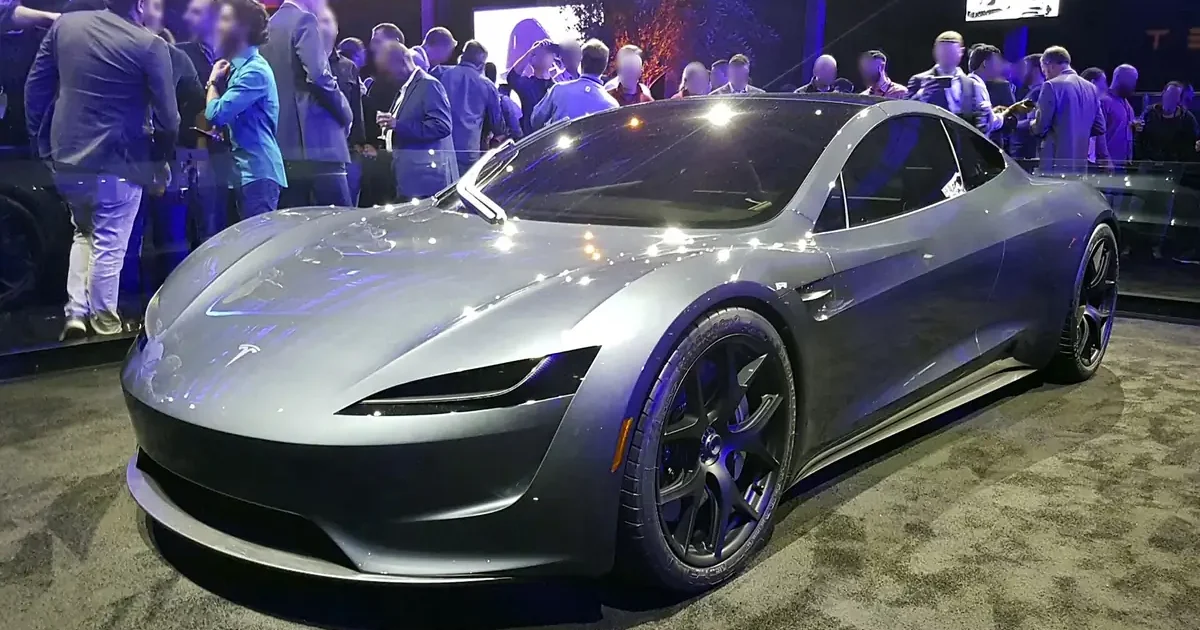 Silver second-generation Tesla Roadster prototype on display at its November 2017 launch event, with a crowd of attendees behind it
