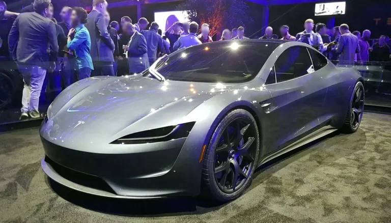 Silver second-generation Tesla Roadster prototype on display at its November 2017 launch event, with a crowd of attendees behind it