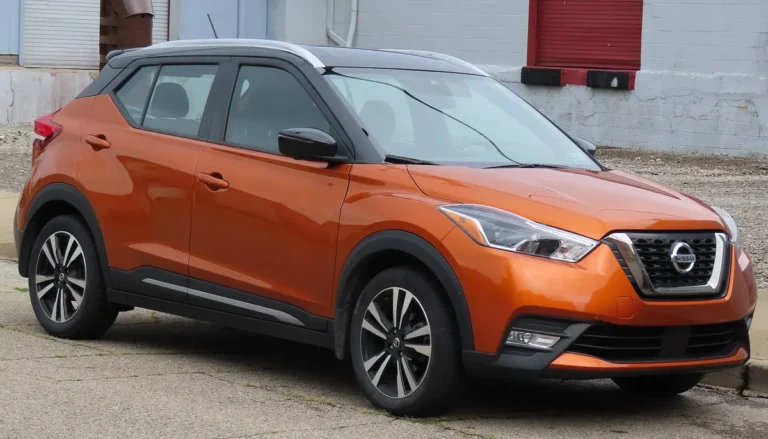 Orange 2020 Nissan Kicks SR crossover parked on a street, seen from the front right