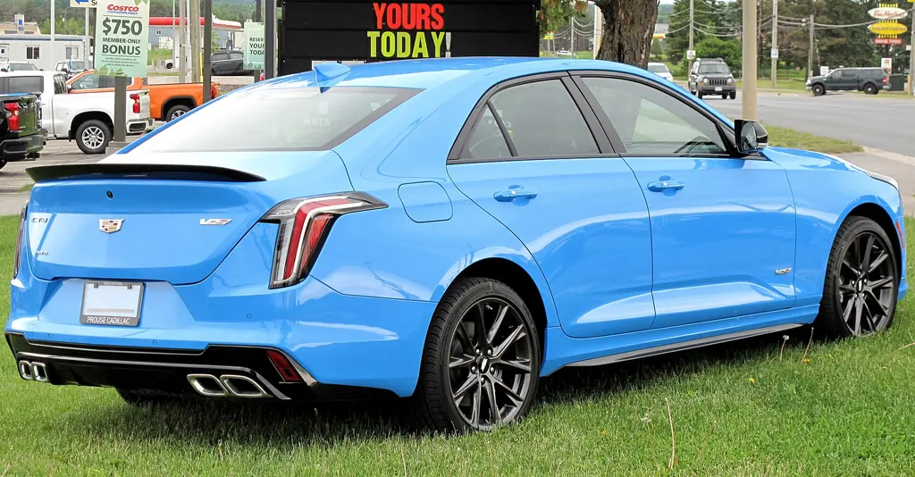 2022 Cadillac CT4-V - rear 3/4 exterior, Electric Blue