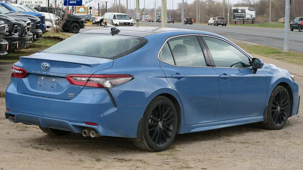 2023 Toyota Camry XSE (XV70 facelift) - rear 3/4 exterior, Cavalry Blue