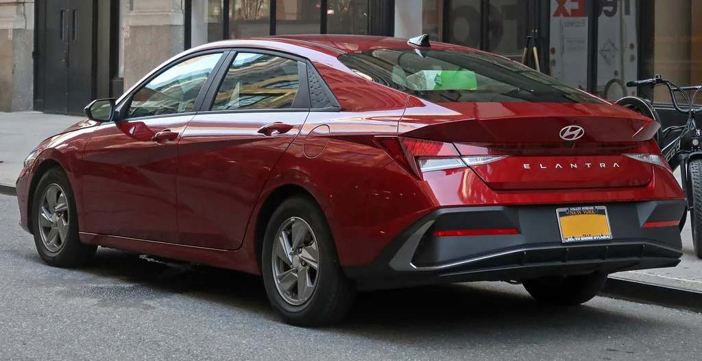 2024 Hyundai Elantra SE (7th gen CN7 facelift) - rear 3/4 exterior, red