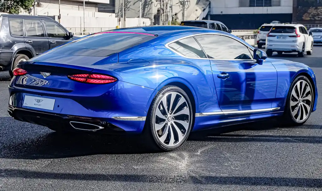 2025 Bentley Continental GT - rear 3/4 exterior, second color (4th gen Speed hybrid)
