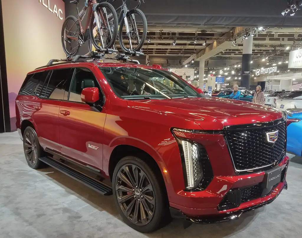 2025 Cadillac Escalade (facelift) - front 3/4 exterior, red (auto show)