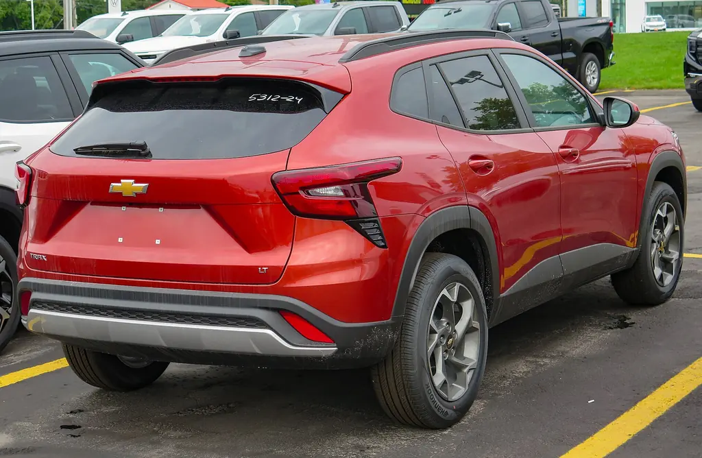 2025 Chevrolet Trax LT (2nd gen, 2024+ MY) - rear 3/4 exterior, Cayenne Orange