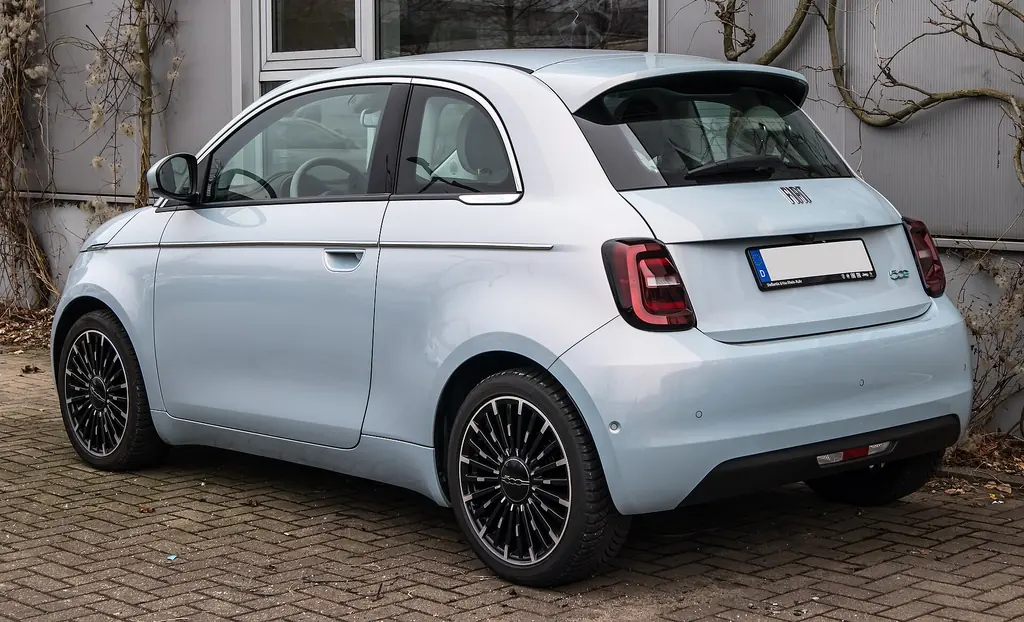 2025 Fiat 500e - rear 3/4 exterior (2nd gen 332, La Prima hatchback)