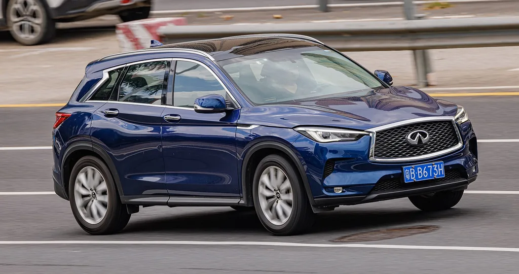 2025 Infiniti QX50 - front 3/4 exterior, on the road (J55, blue)
