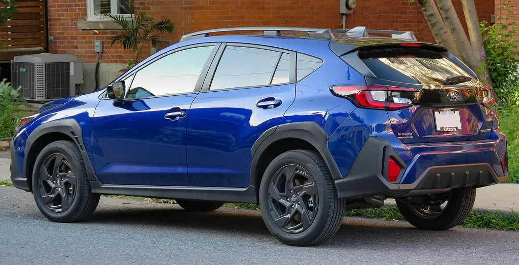 2025 Subaru Crosstrek Onyx (3rd gen GU, 2024+ MY) - rear 3/4 exterior, Sapphire Blue Pearl