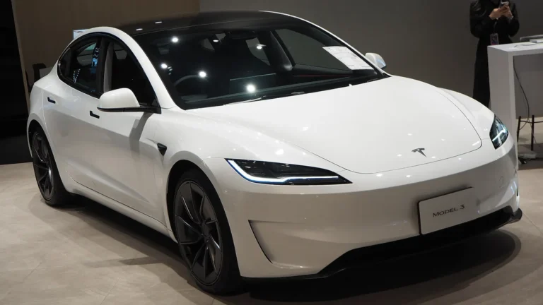 2025 Tesla Model 3 (Highland refresh, 2024+ model years) - front 3/4, exterior (Performance AWD, showroom)