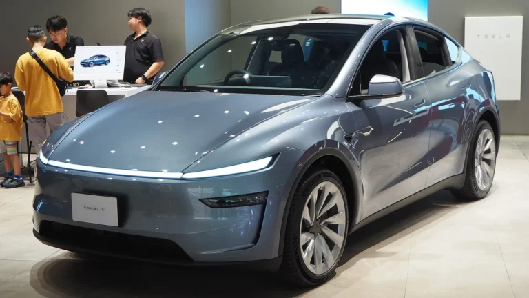 2025 Tesla Model Y (Juniper refresh) - front 3/4, exterior (showroom)