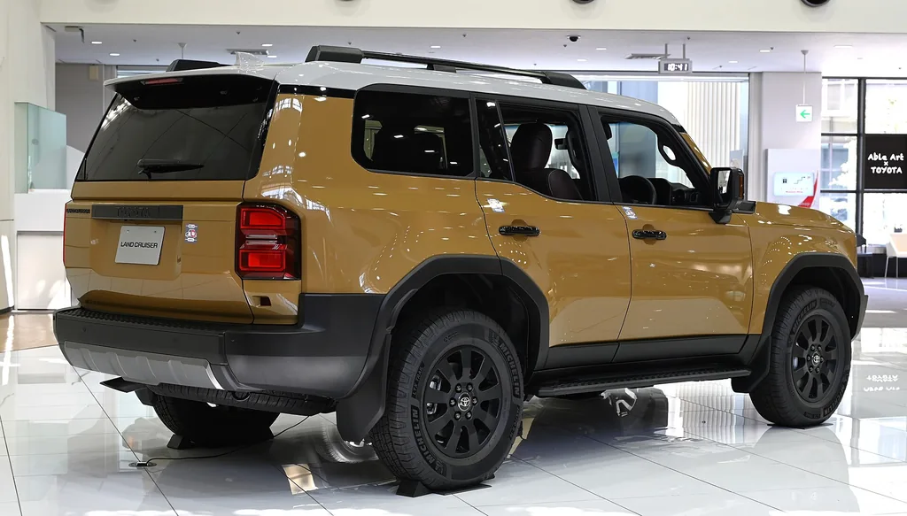 2025 Toyota Land Cruiser - rear 3/4 exterior, second color (J250 First Edition, showroom)