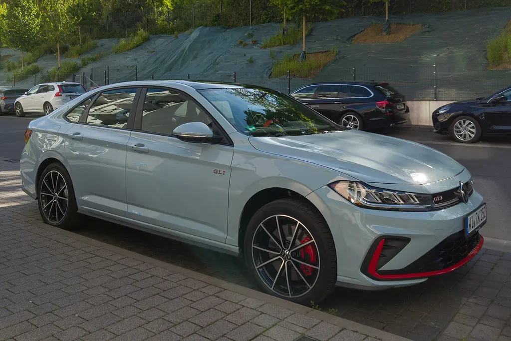 2025 Volkswagen Jetta GLI (A7 facelift) - front 3/4 exterior, light grey