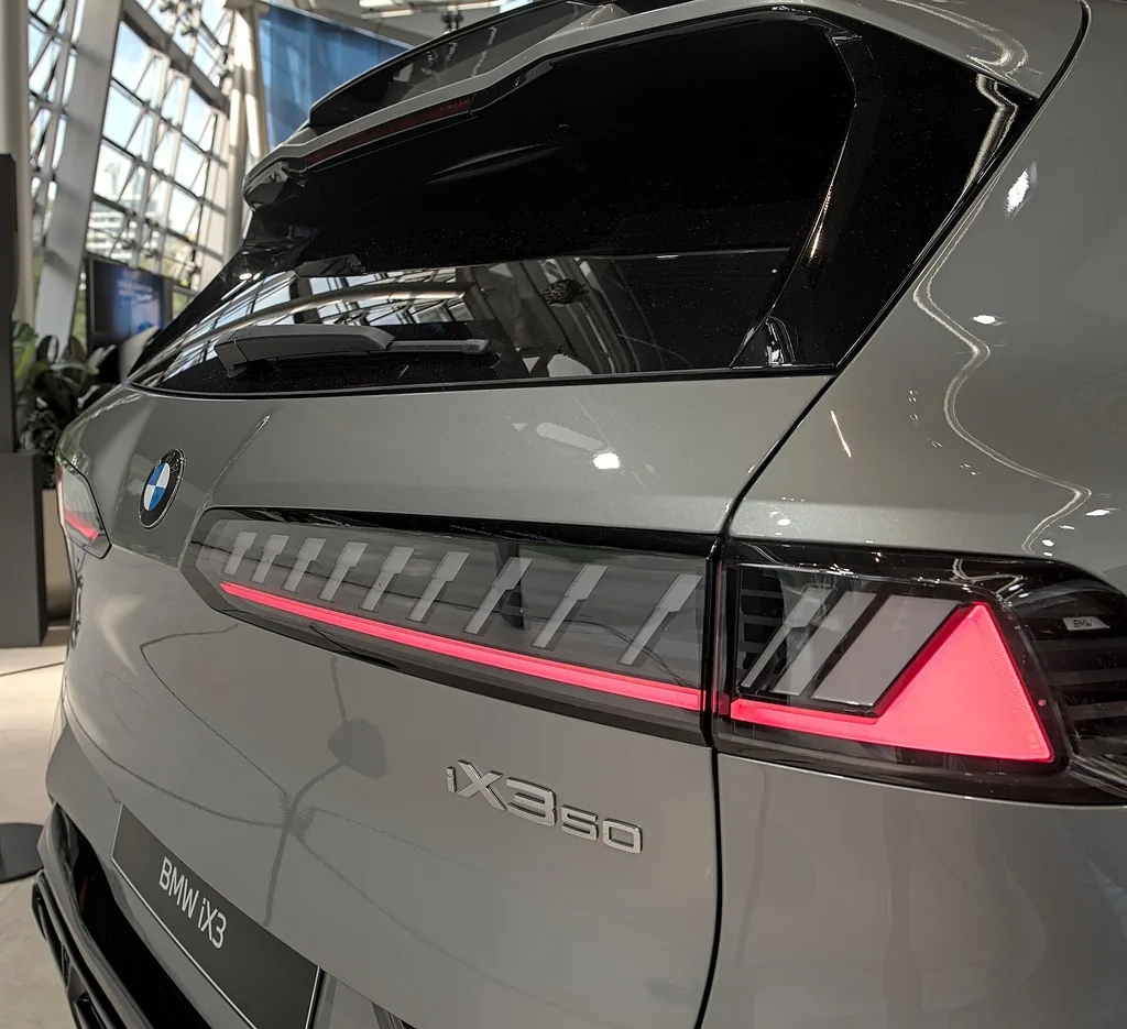 BMW iX3 (NA5, Neue Klasse) - detail: tail lamp and badge