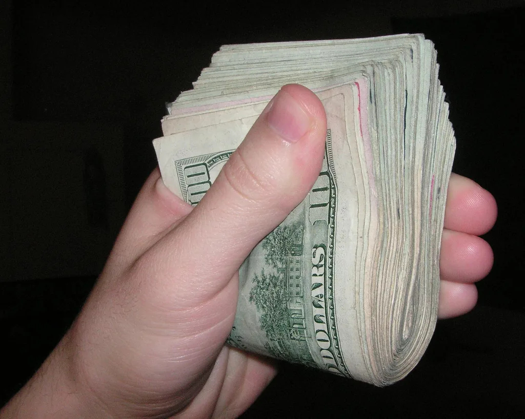 Stack of U.S. dollar bills representing a down payment (Wikimedia Commons, public domain)