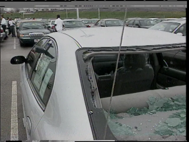 Hail damage to a car in Missouri, April 2001, the kind of loss comprehensive coverage pays for; NWS photo (public domain)