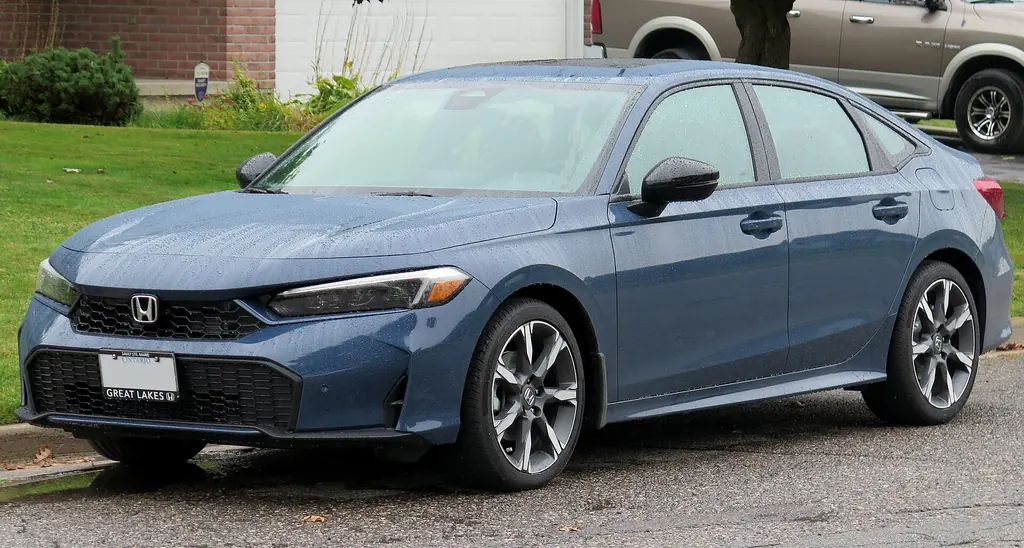 2025 Honda Civic Sport Touring Hybrid sedan, front three-quarter view (current 11th generation). Photo: Elise240SX, CC BY-SA 4.0, Wikimedia Commons