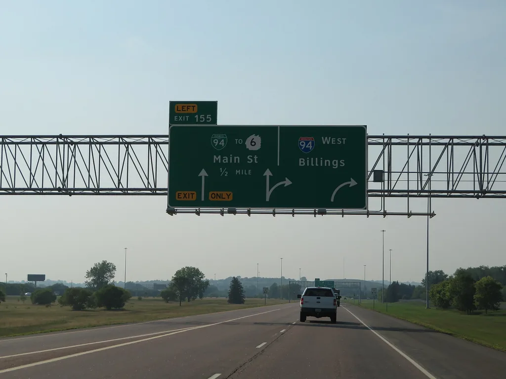 Interstate 94 near Mandan, North Dakota, the state with the lowest 2023 NAIC average auto insurance expenditure (CC BY-SA 2.0, Wikimedia Commons)
