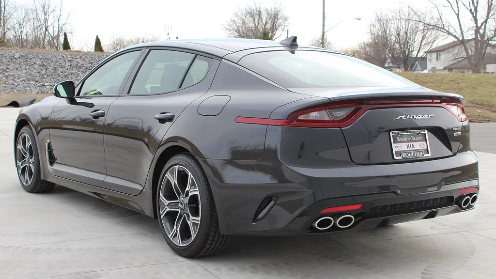 Kia Stinger (pre-facelift, US-market 2020) - rear 3/4 exterior, grey